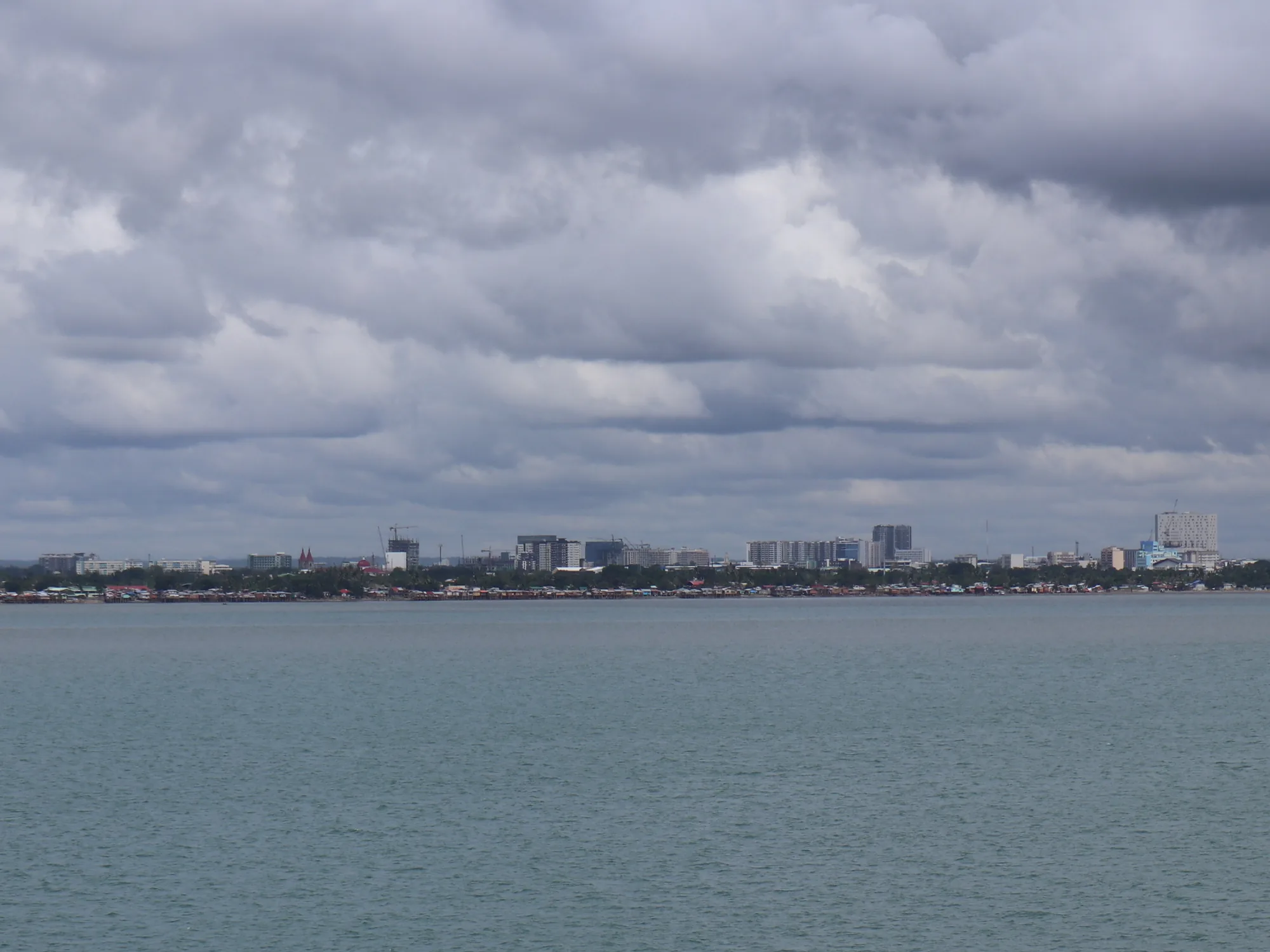 Iloilo Molo-Mandurriao skyline, Iloilo Strait (Iloilo City; 01-27-2023)